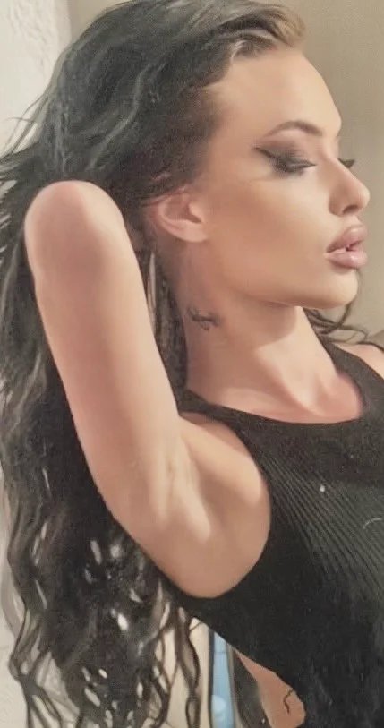 Profile portrait of Lana Bajc with wet dark hair.